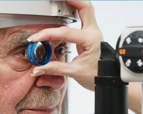 An ophthalmologist checks the vision of an elderly person using modern equipment. The concept of advertising ophthalmological services and medical technologies.